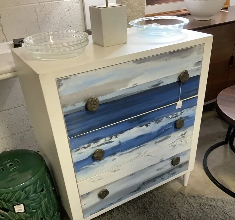 A hand-painted blue and white dresser at B&H Market on the Dan